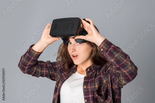 young girl testing virtual reality glasses © ponomarencko