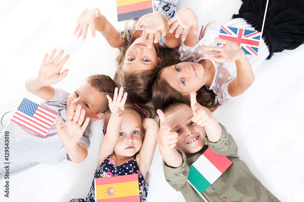 poland group holding flags of different countries. German flag, flag england, spain flag, flag of america, flag of russia, france flag, flag canada