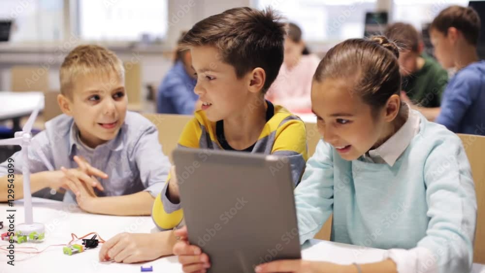 kids with tablet pc programming at robotics school kids with tablet pc programming at robotics school