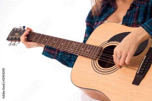 woman playing guitar in studio
