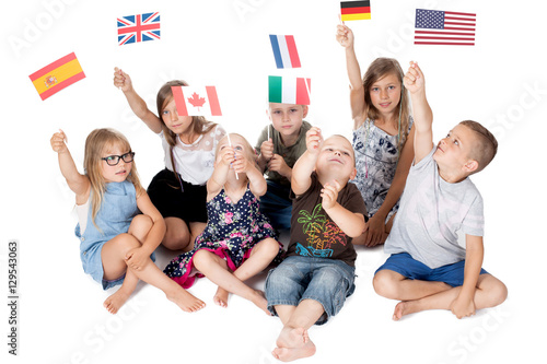 Obraz na płótnie poland group holding flags of different countries. German flag, flag england, spain flag, flag of america, flag of russia, france flag, flag canada w salonie