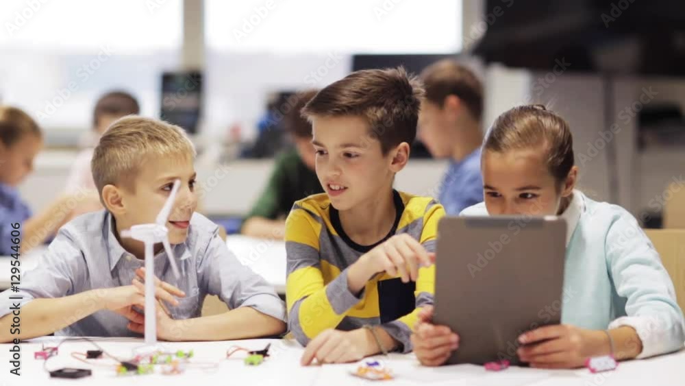 kids with tablet pc programming at robotics school kids with tablet pc programming at robotics school