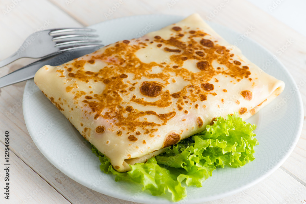 Russian delicious pancakes on a white plate