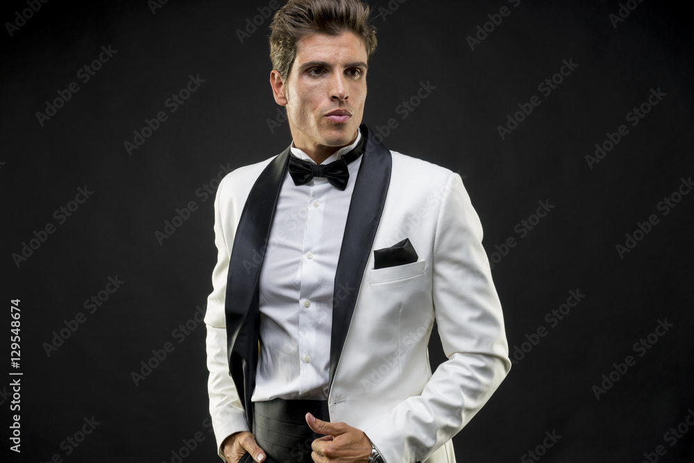 Elegant and handsome man dressed in tuxedo for New Year's Eve or Elegant and handsome man dressed in tuxedo for New Year's Eve or