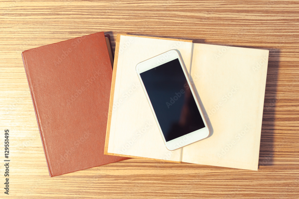 Smartphone on wooden table Smartphone on wooden table