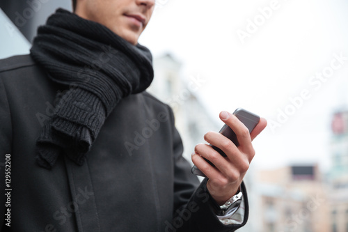 Cropped image of business man with phone