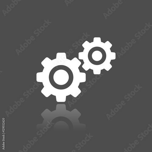 Icono engranajes sobre fondo oscuro con reflejo