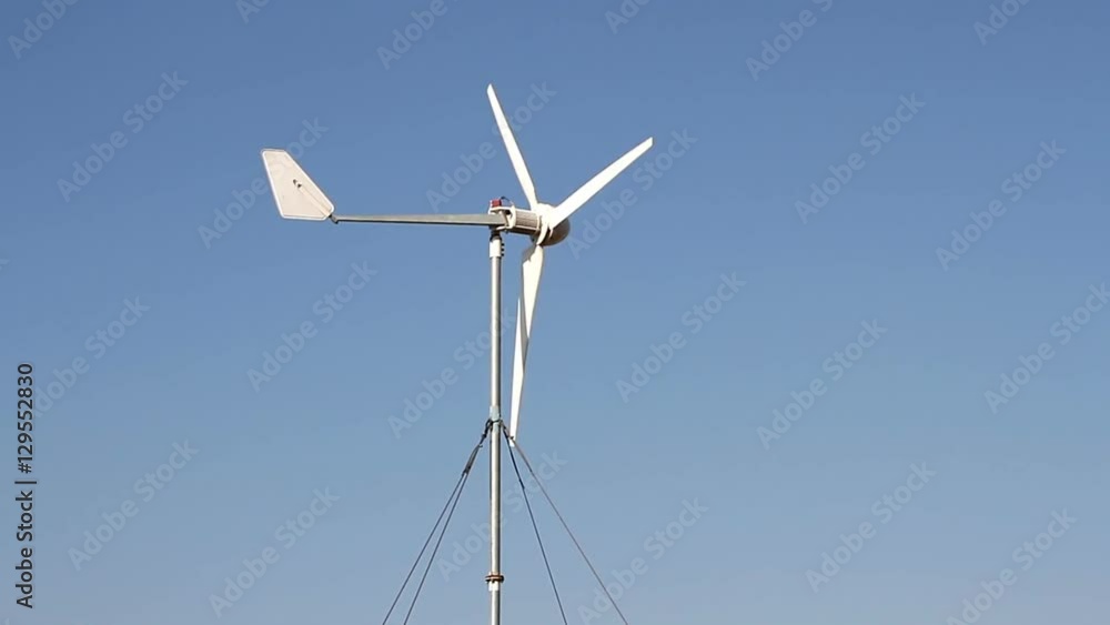 Row of wind power generator over blue sky