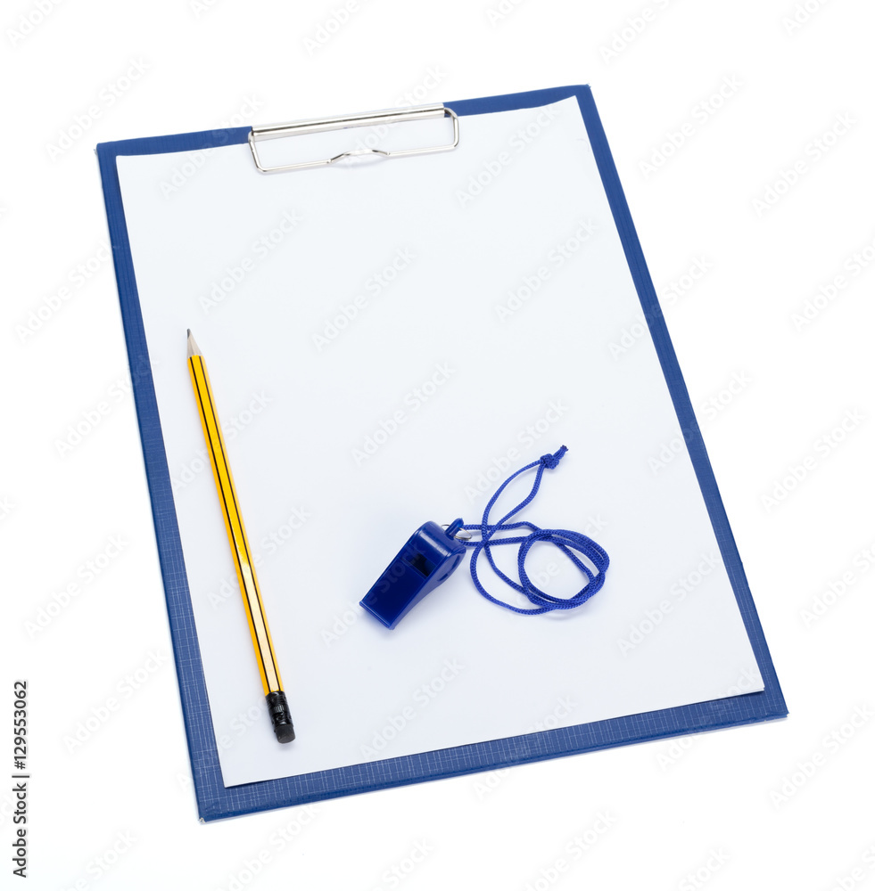 A blank clipboard and a coaches whistle with copy space A blank clipboard and a coaches whistle with copy space