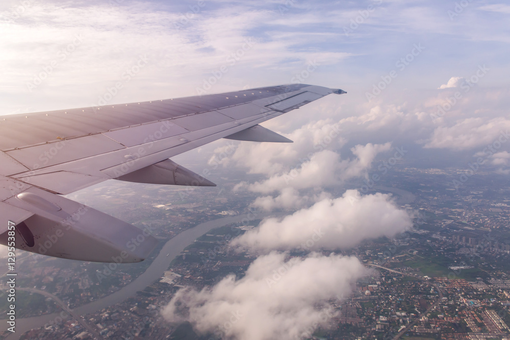 Fototapeta premium Blue sky and Clouds as seen through window of aircraft