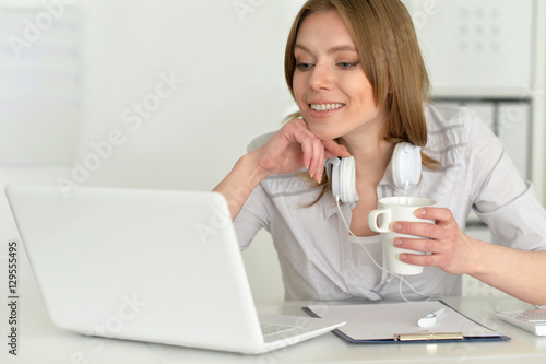 Young attractive businesswoman with laptop