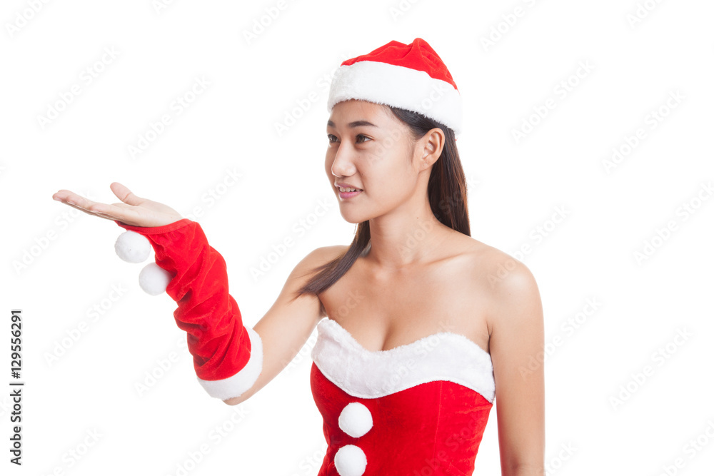Asian Christmas Santa Claus girl present space on her hand. Asian Christmas Santa Claus girl present space on her hand.