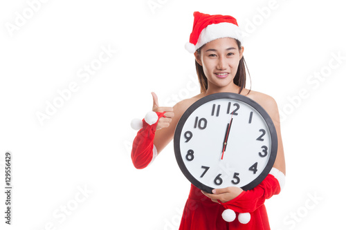 Asian Christmas Santa Claus girl  thumbs up and clock at midnigh photo