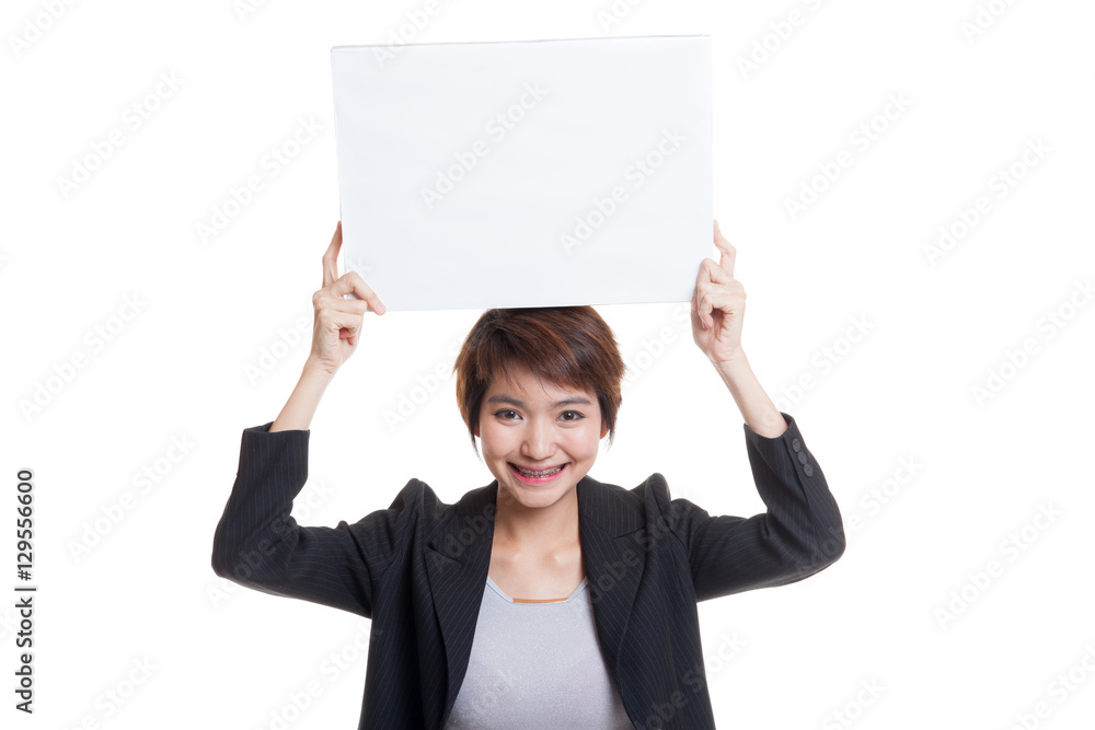 Young Asian business woman with white blank sign. Young Asian business woman with white blank sign.