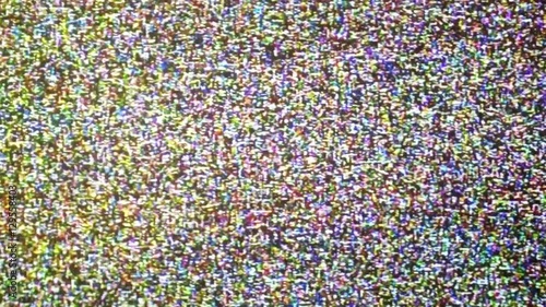 Retro VHS screen with white noise and flickering glitch. Great for a VHS texture in your projects photo