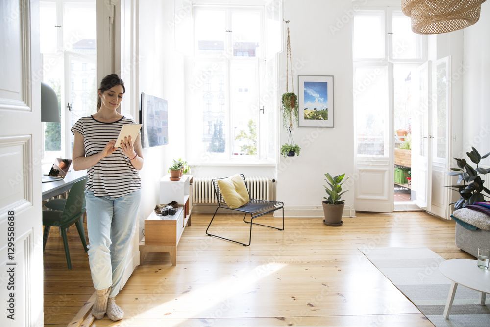 Woman at home using tablet Woman at home using tablet