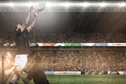 Composite image of rugby fans in arena photo