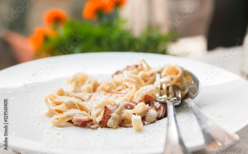 Traditional italian pasta carbonara with bacon and egg