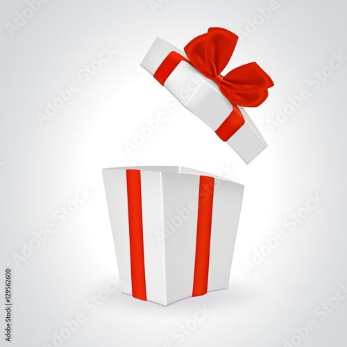 Open white gift box with red ribbon.