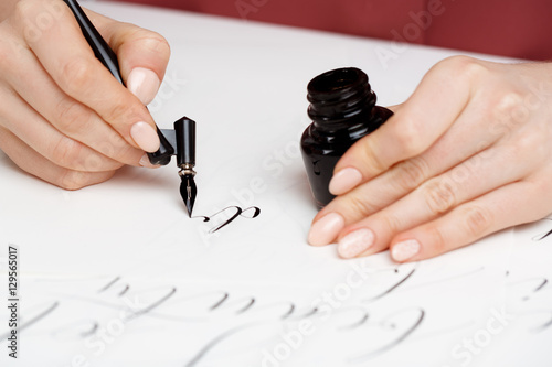 Obraz na plátně Girl writing calligraphy on postcards. Art design.