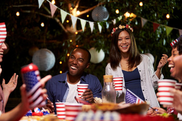 Friends Celebrating 4th Of July Holiday With Backyard Party
