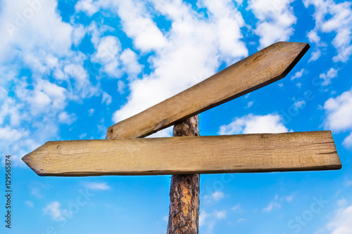 Arrow signboards on sky background