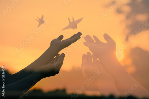 Human hands open palm up.Silhouette of one helping hand,Silhouette of woman praying over beautiful sky background,Silhouette of pigeon and freedom,