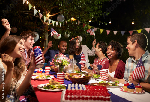 Friends Celebrating 4th Of July Holiday With Backyard Party