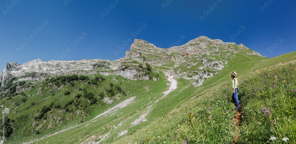 View of the mountains and valley on the hiking trail View of the mountains and valley on the hiking trail