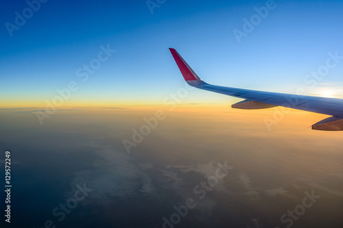 Sunrise sky from airplane window