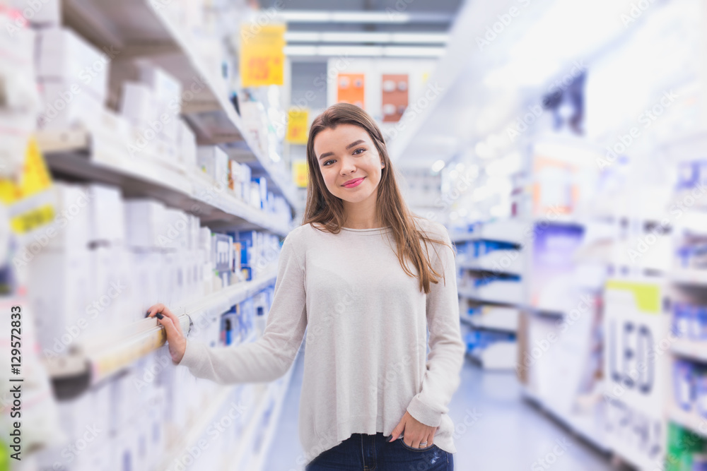 happy female customer shopping in hardware store happy female customer shopping in hardware store
