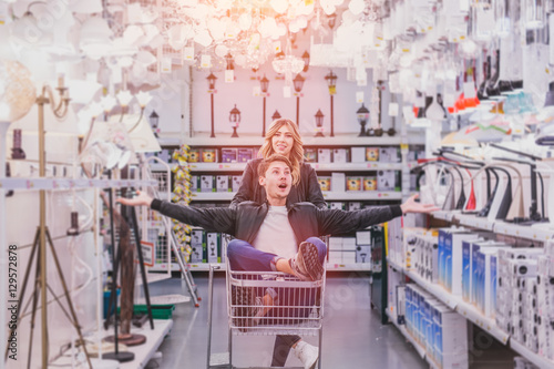 Quadro su tela young couple shopping for DIY tools at hardware store