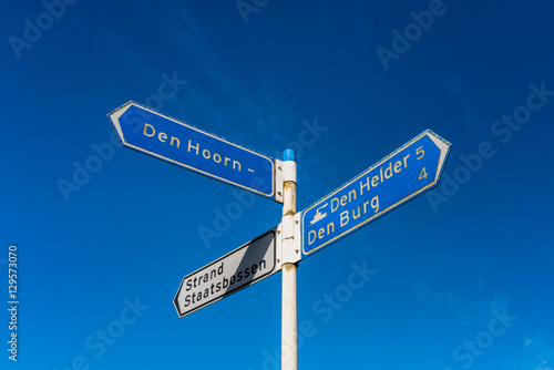 Directional Signs pointing to several destinations on Dutch island Texel. photo