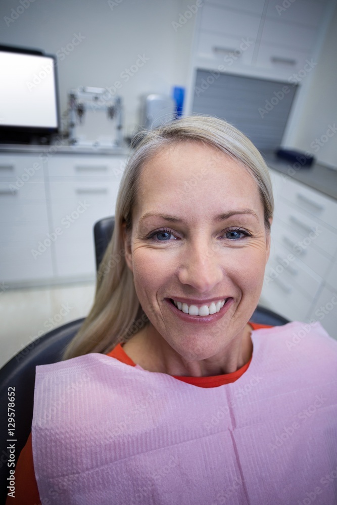 © WavebreakMediaMicro - Female patient sitting on dentist chair