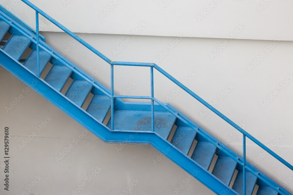 Fototapeta premium blue steel stair outside of building for fire exit