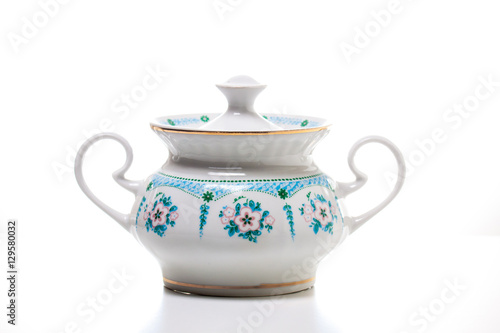 Sugar bowl on white background. Tea time. Porcelain dishes. 