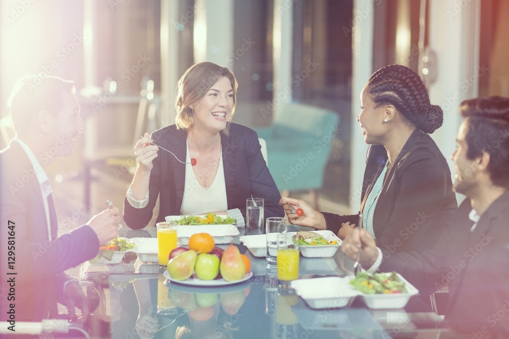 Group of business people having breakfast together Group of business people having breakfast together