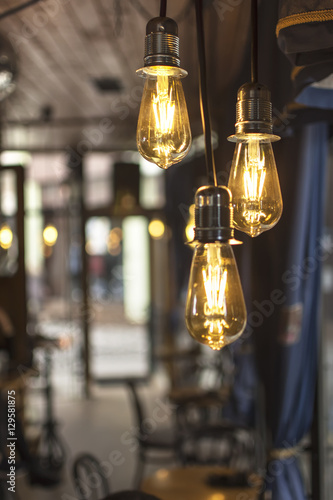 Old Style Glowing Light Bulbs Hanging in Bar