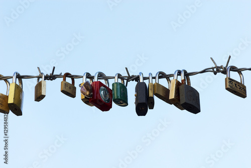 Love locks hang from a bridge in Prague representing secure friendship and romance