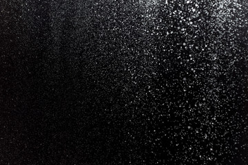 Real snow on black background