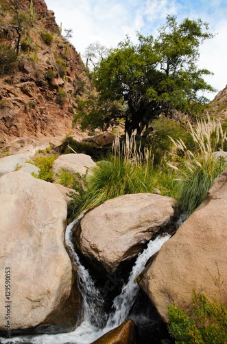 Long shot of a waterfall on the Cascadas del rio Colorado Trek close to Cafayate in Argentina, South America