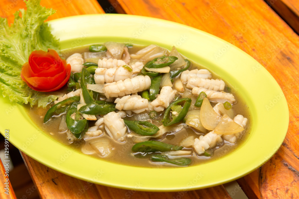 Squid cuisine served with spicy sour filling sauce, green sweet chili, and onion. Squid cuisine served with spicy sour filling sauce, green sweet chili, and onion.