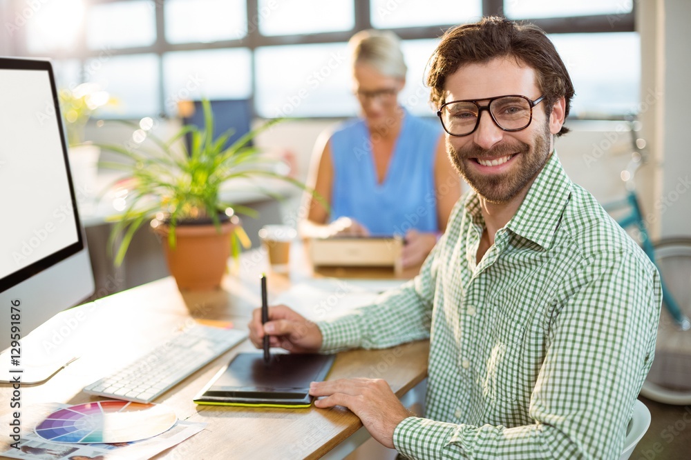 Graphic designer using graphics tablet Graphic designer using graphics tablet