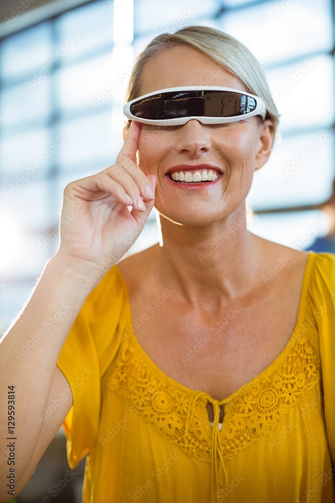 Female business executive using virtual reality video glasses Female business executive using virtual reality video glasses