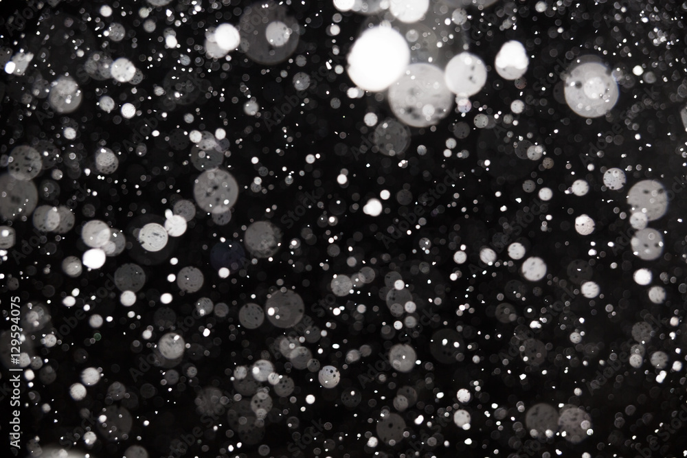 Falling snow on black background Falling snow on black background