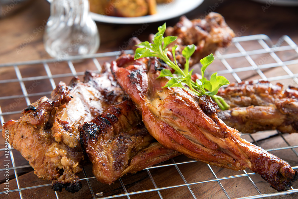 Assorted grilled meat on wooden table