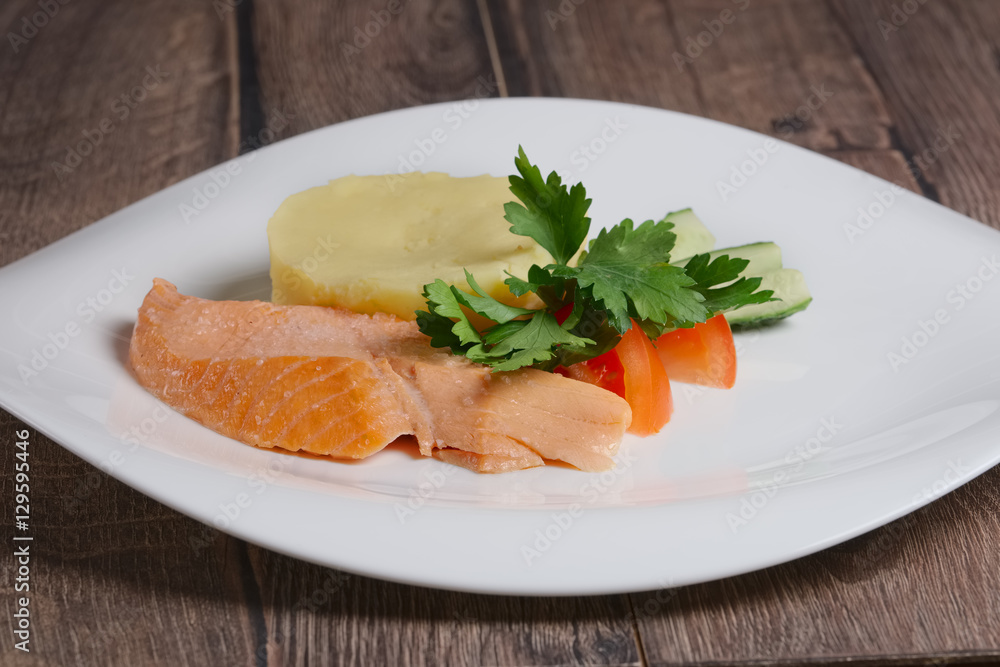 salmon fillet with mashed potato and vegetables