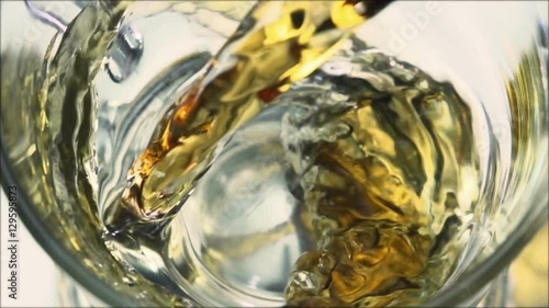Tea being poured into glass tea cup