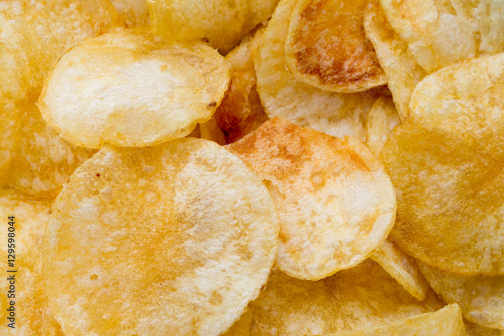 Close up potato chips on wood top view background. Close up potato chips on wood top view background.