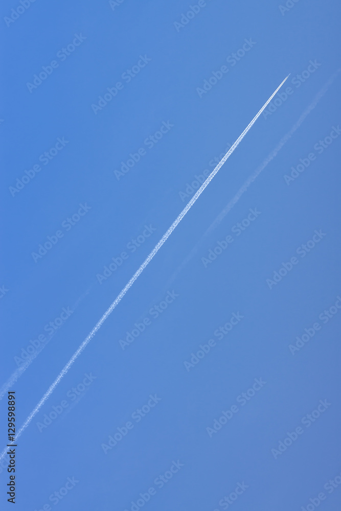 Trace of an airplane in the blue sky